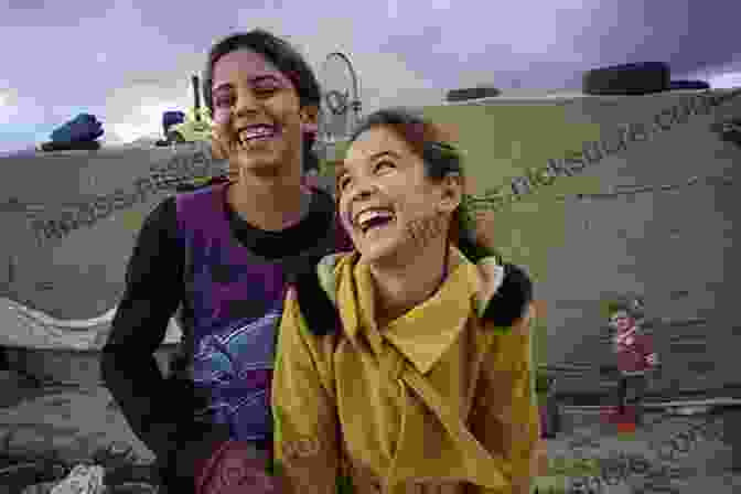 A Group Of Refugee Girls Laughing And Playing We Are Displaced: My Journey And Stories From Refugee Girls Around The World