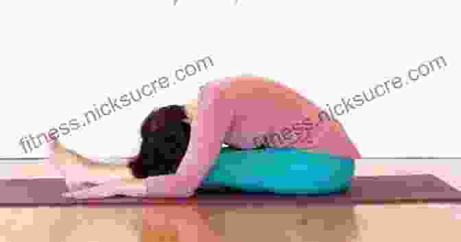 A Person Practicing Yin Yoga In A Seated Forward Fold Position The Complete Guide To Yin Yoga: The Philosophy And Practice Of Yin Yoga