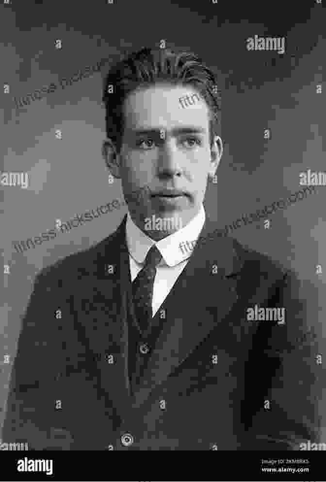 Niels Bohr, A Black And White Photo Of A Man With Short Hair And A Mustache, Wearing A Suit The Second Creation: Makers Of The Revolution In Twentieth Century Physics